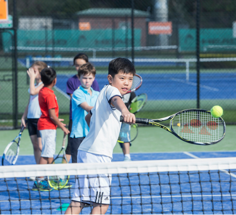 Playing tennis at Boroondara Tennis Centre