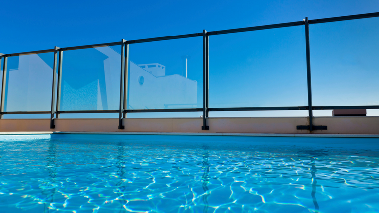 water in a pool with a fence