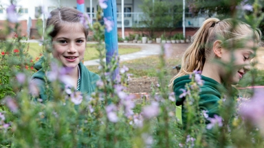 Two girls in the garden of a local primary school.