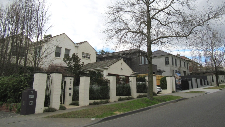 Front facades of two houses.