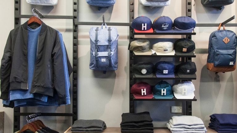 Caps, jackets and backpacks on display at a local clothing retailer.