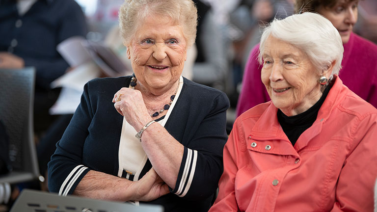 Two women sit in the audience at a Boroondara Seniors Festival 2019 event