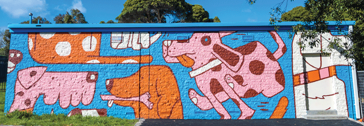 A brightly coloured mural of dogs