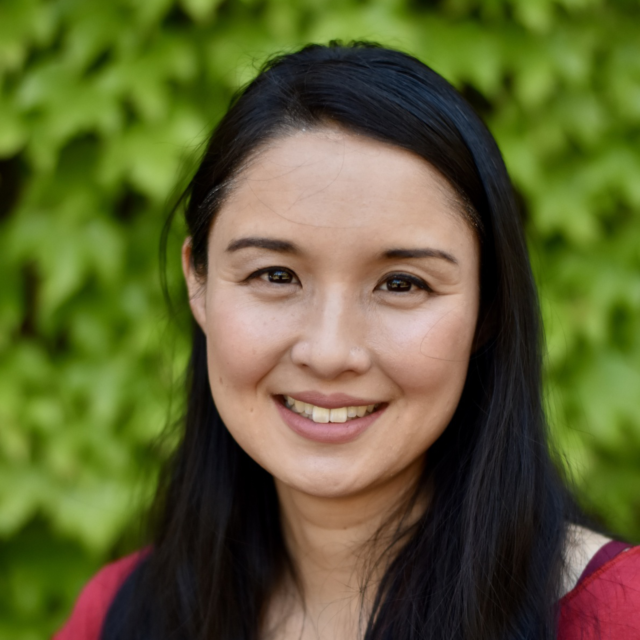 headshot of a person smiling