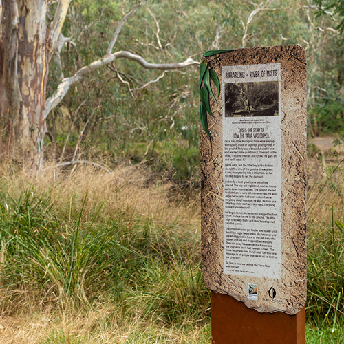 An information board along the yarra river with the indigenous story of how the yarra was formed