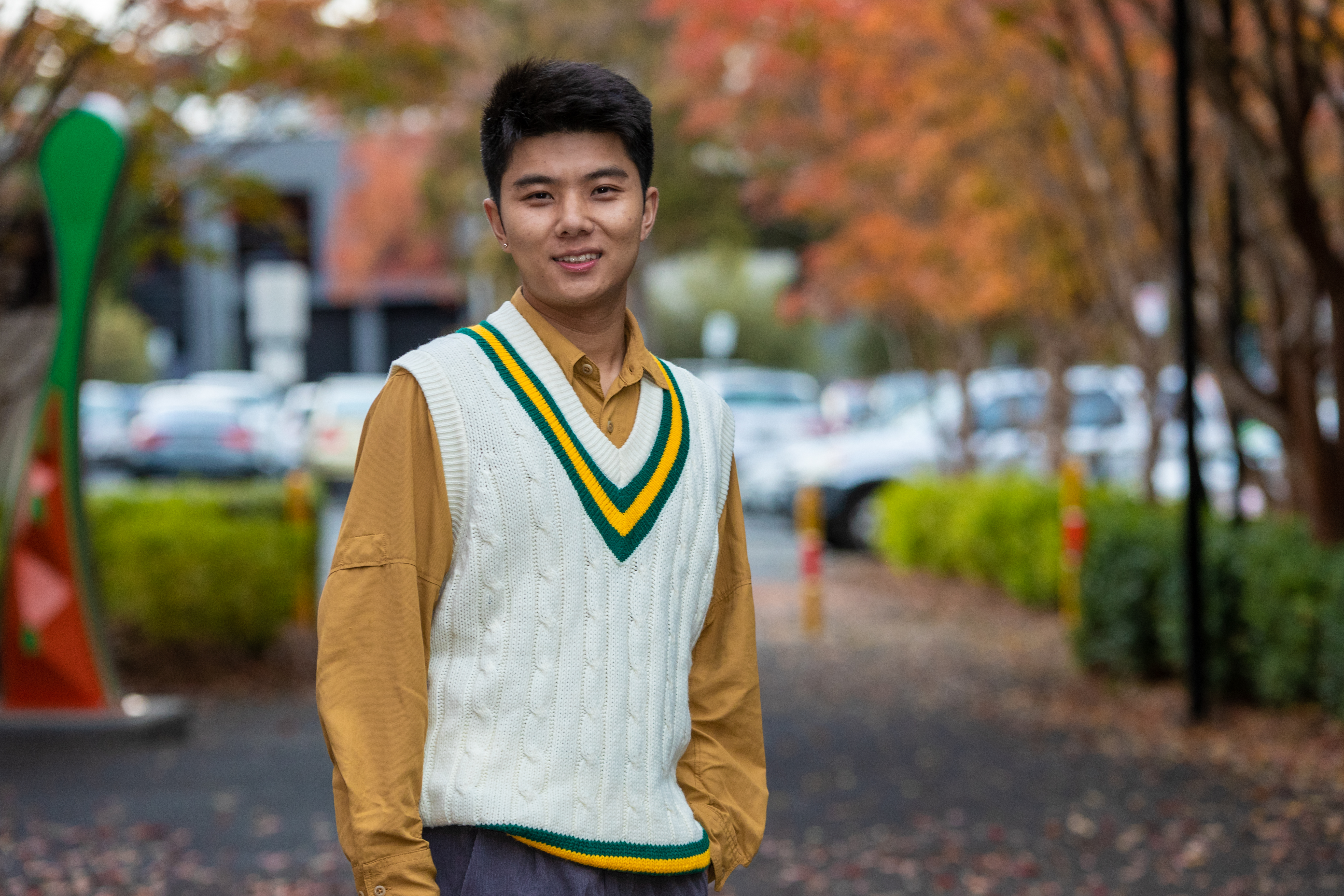 Micahel Tian standing outside smiling
