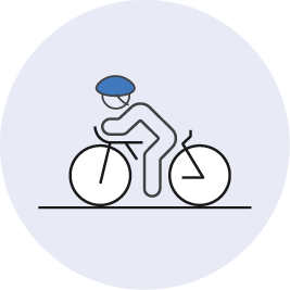 Figure of a person riding a bike and wearing a helmet