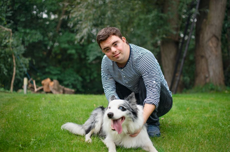 A person with their dog in the park