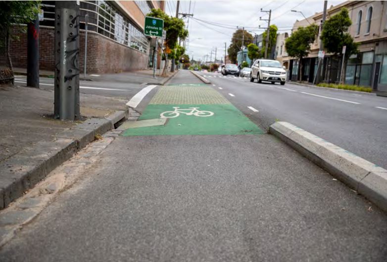 A bike path protecting by kerbing along a road