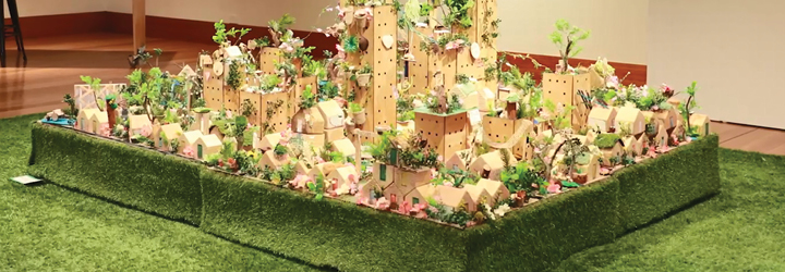 A miniature city built from cardboard and found materials