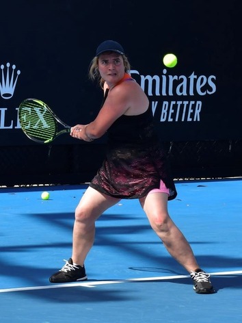 a woman playing tennis