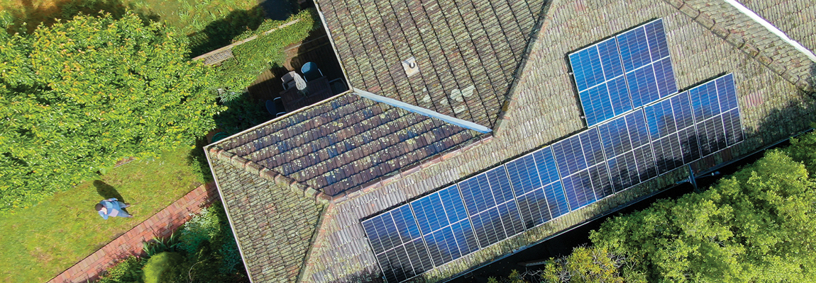 Aerial view of solar panels on a house roof