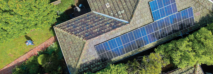 Aerial view of solar panels on a house roof