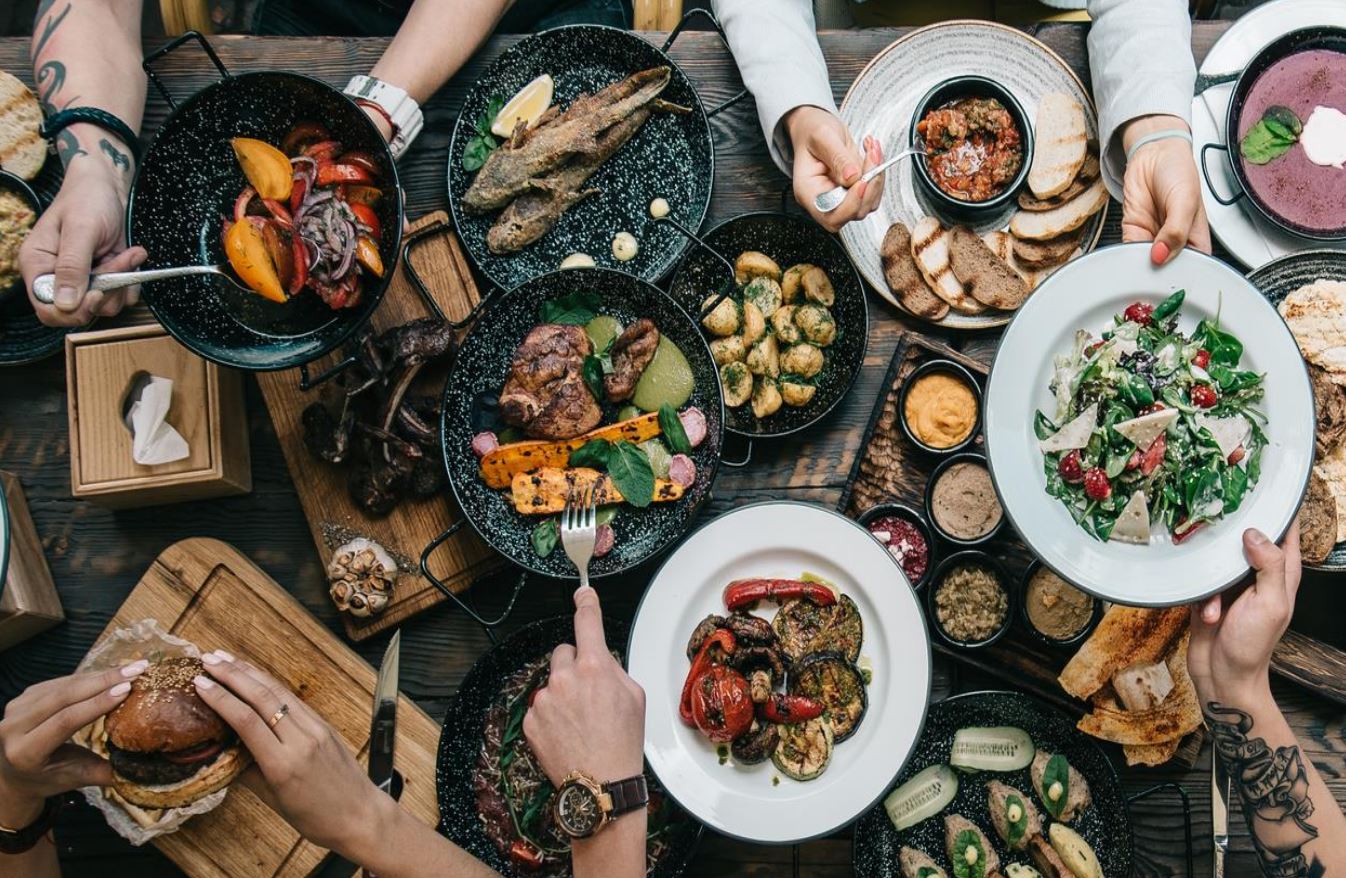 A table covered by bowls of different foods