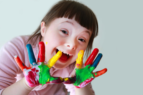 A young child using paint