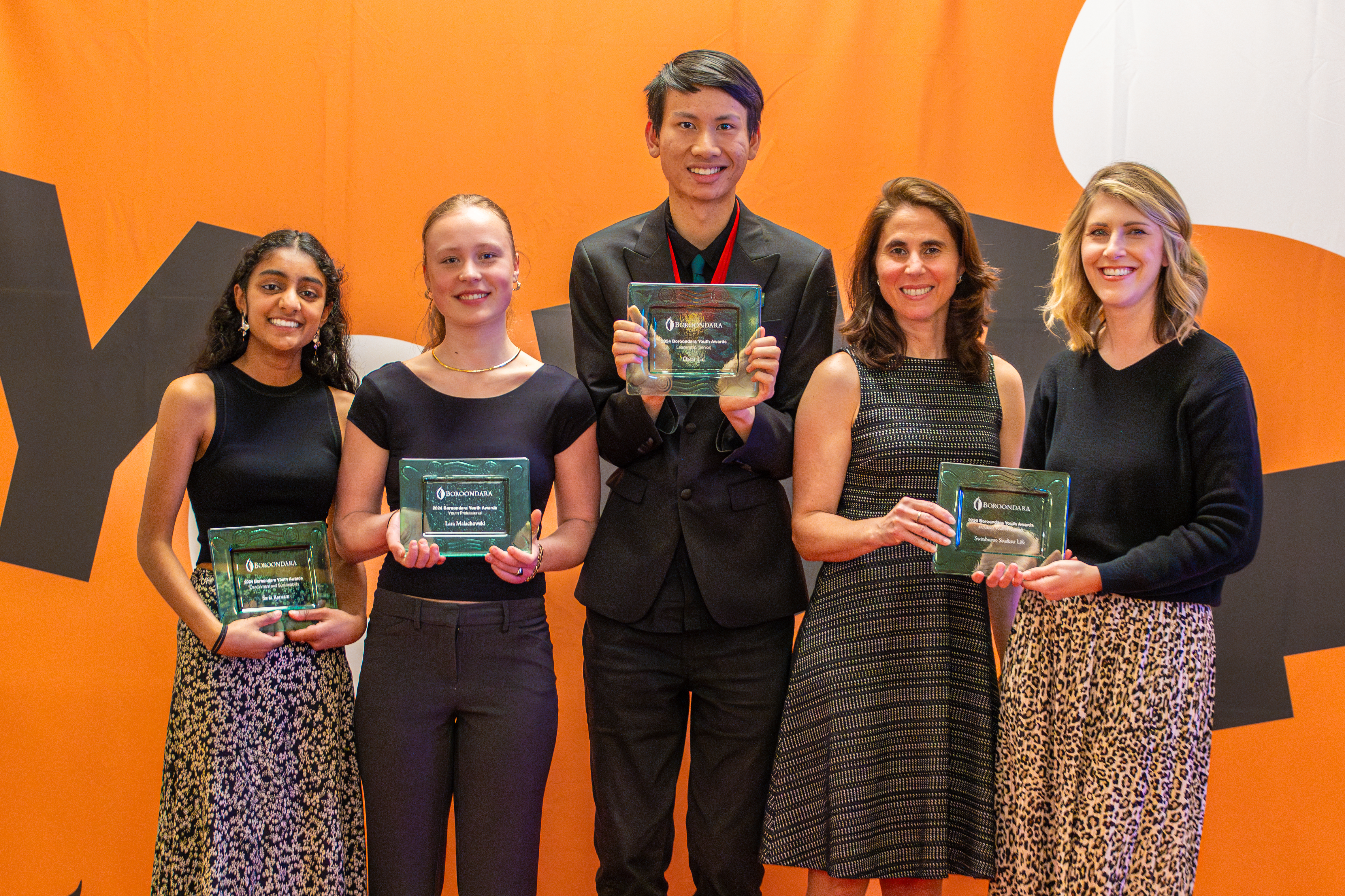 5 young people holding certificates