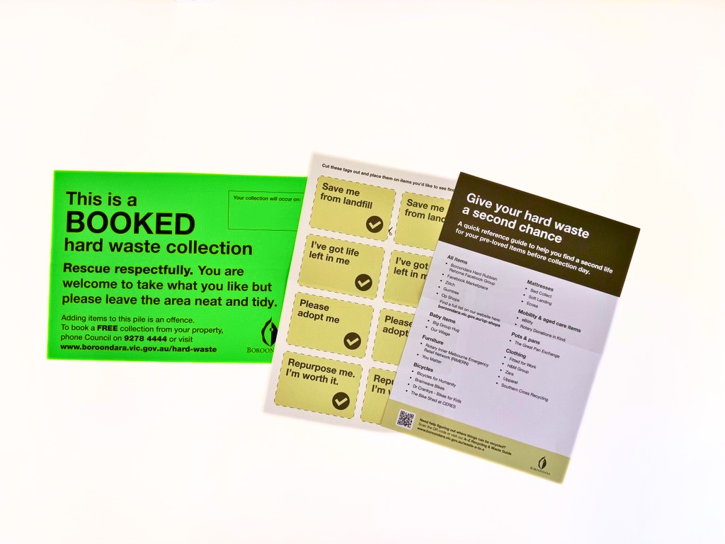 A bright green sticker with 'this is a booked hard waste collection' written on it. There are also flyers with ideas on how to recycle items and labels to put on items that could be taken.