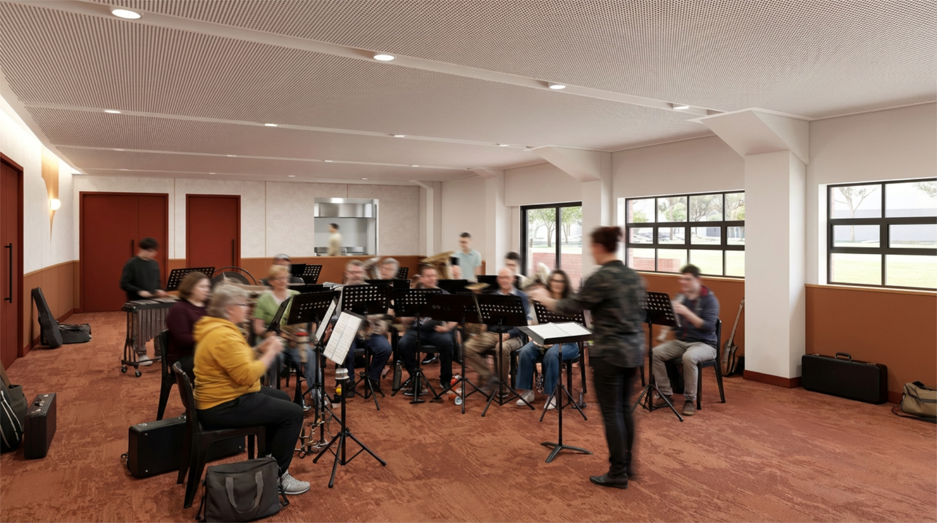 A large, carpeted multipurpose space. There's an opening through to a kitchen. The space is currently being used for a concert band rehearsal.