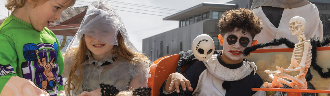 Primary school kids dressed up as Halloween ghouls in the street