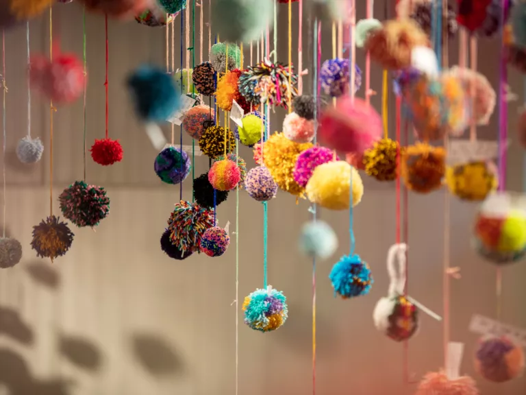 Lots of pompoms in different sizes and colours.