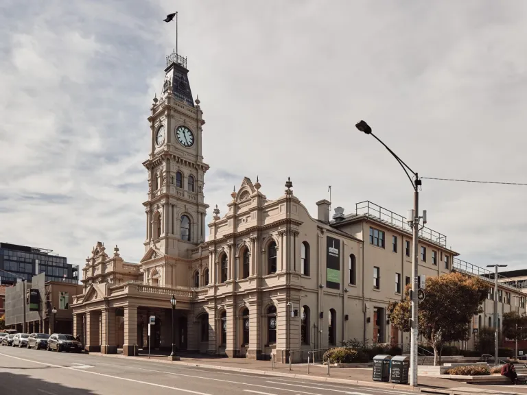 The hawthorn arts centre double story building from the street, showing the 4 storey clock tower and hertiage style of the building