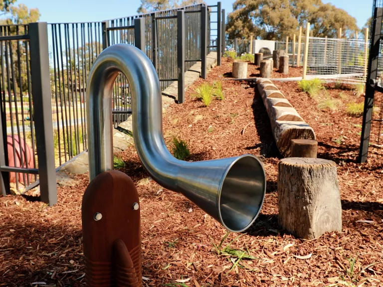 a stainless steel musical instrument at a playground