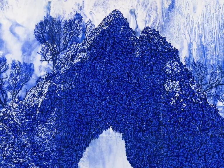 This image shows a landscape featuring a natural rock formation shaped like an arch. The scene is rendered entirely in shades of blue, creating a monochromatic effect. The rock surface is textured with intricate patterns resembling dense clusters or foliage, and small trees or shrubs grow on top of the formation. The arch opens to a view of the background, where additional rock formations and sky are visible. The sky is marked with painterly streaks and variations in tone. The foreground includes more textu