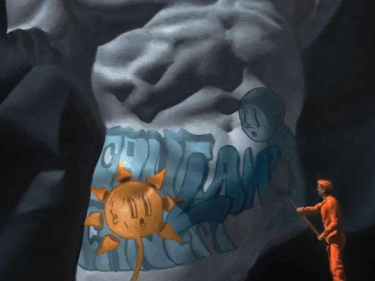 A painting of classical marble torso sculpture with a rough, broken edge is adorned with modern graffiti-style artwork, featuring a cartoonish sun and blue lettering appearing like shorts on the sculpture. A tiny figure in an orange jumpsuit, resembling a worker or restorer, stands on a pedestal, appearing to paint or clean the graffiti. The scene is set against a dark background. 