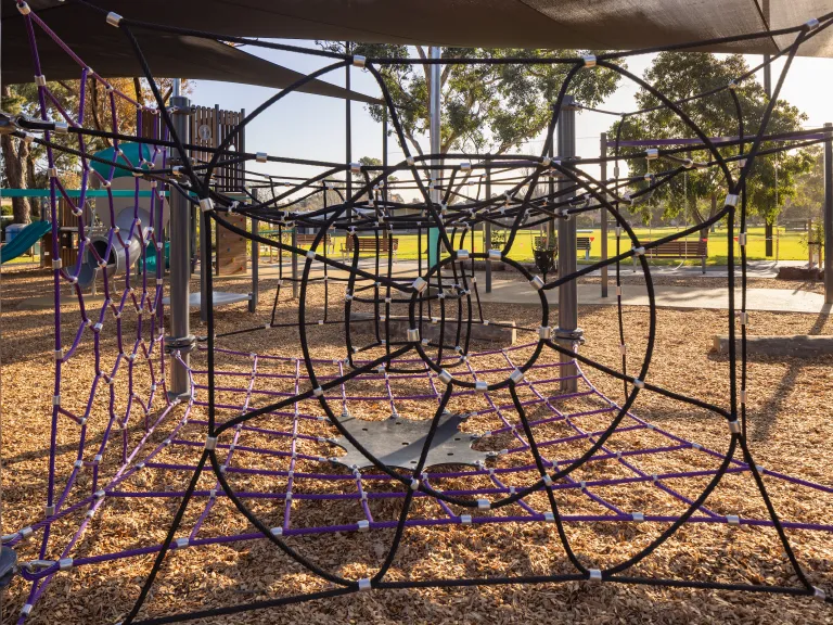 A rope climbing unit at a playground 