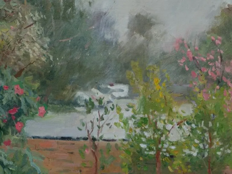 Painting of a view with a big tree on the left with pink flowers. Branches sit in the middle with pink flowers. A short brick wall sits behind the trees. There are blurry green patches, some figures and cars in the distance. 