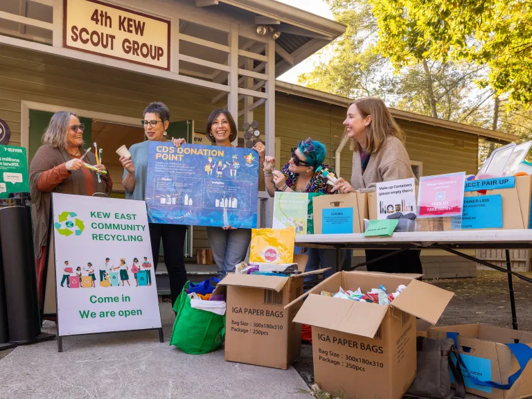 Women running a recycling stall outdoors
