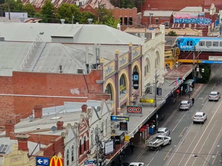  Arial view of Glenferrie road, looking down at the tramlines, trainline and shops.