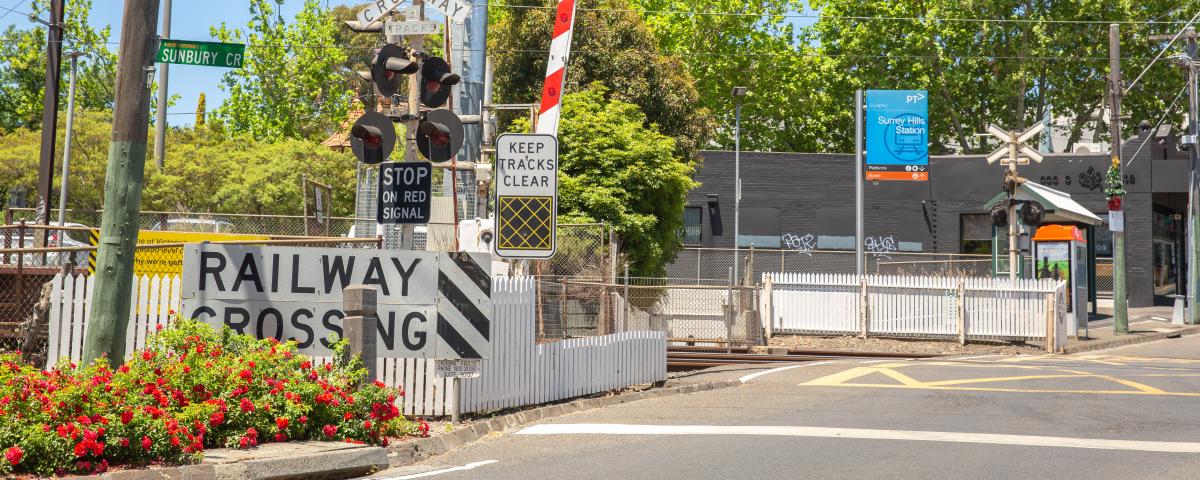 The level crossing at Surrey Hills on a sunny day