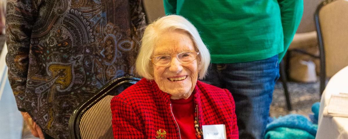 Woman attending a centenarians luncheon