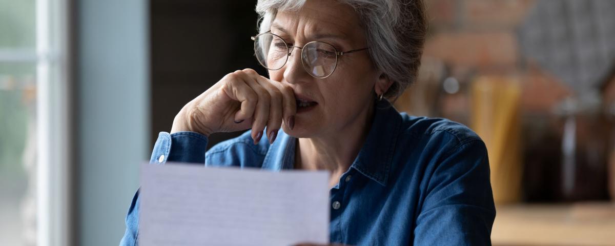 A person reading a letter
