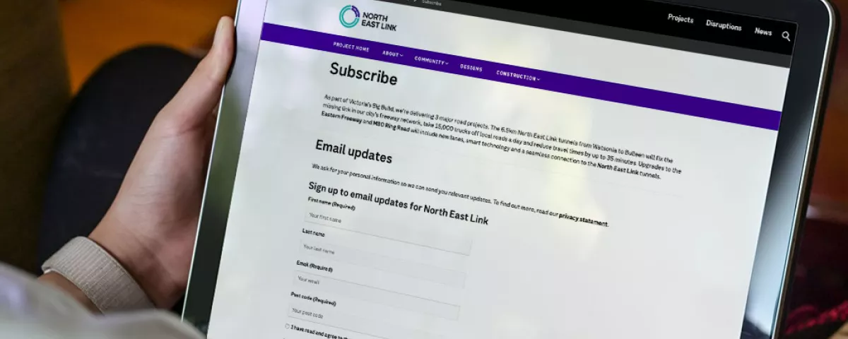 A tablet screen showing a email update sign up page on  Victoria's Big Build website