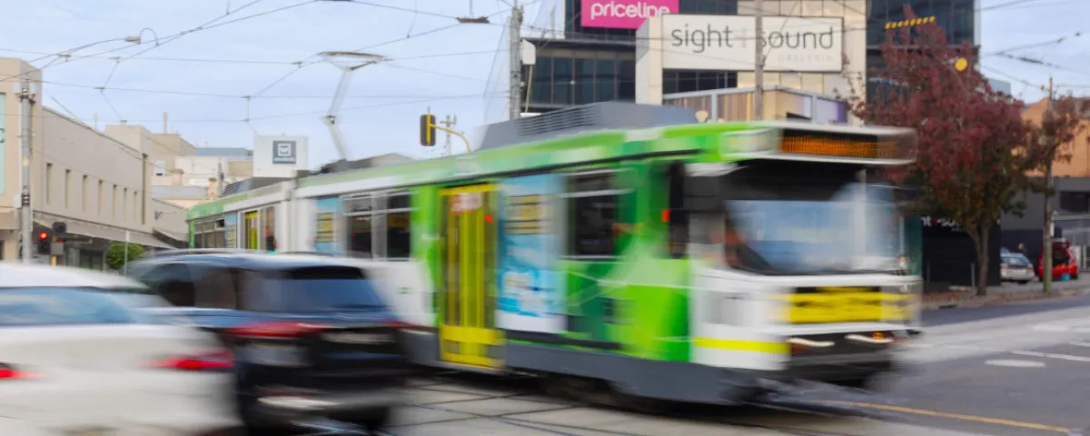 Blurred image of tram and cars at Camberwell Junction.