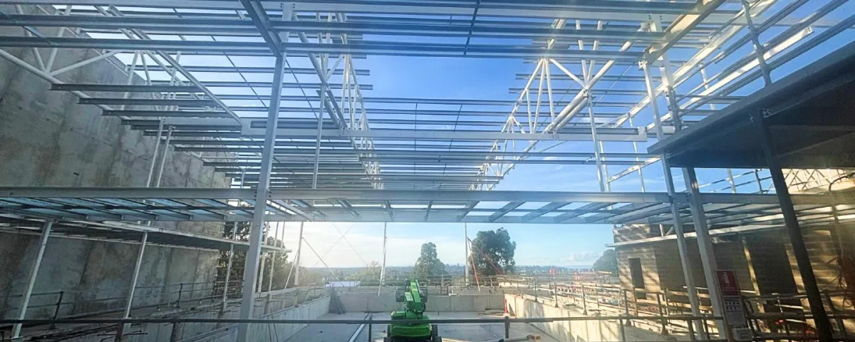 A half built structure with steel frames and beams