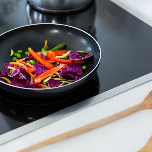 Veggies in frypan on an induction cooktop
