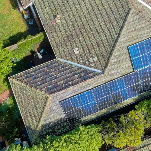 An array of solar panels on a tiled roof
