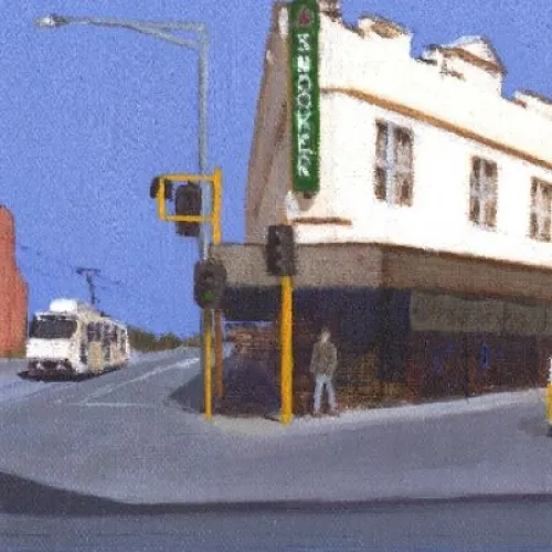 A painted street scene featuring several vintage Volkswagen vans driving through an intersection. A red-and-white van is in the foreground, with yellow, orange, and blue vans further down the road. The street is lined with older buildings, including a white corner building with a green sign, and a church-like structure on the left. The sky is bright blue.