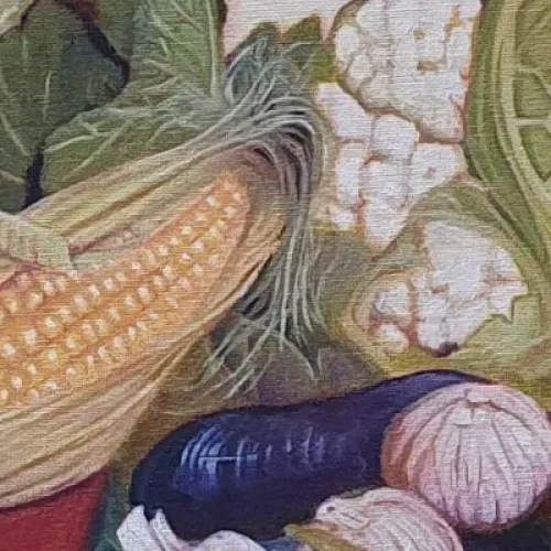 A still-life painting showing assorted vegetables arranged on a patterned, folded blue cloth. The composition includes a red bowl filled with cabbage, tomatoes, and an ear of corn, with cauliflower, eggplants, garlic, an onion, and another tomato placed beside it. 
