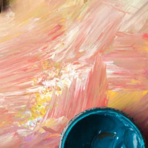 Pots of acrylic paints and paintbrushes