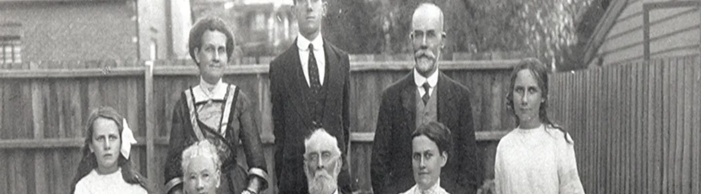 Old photograph of family in backyard