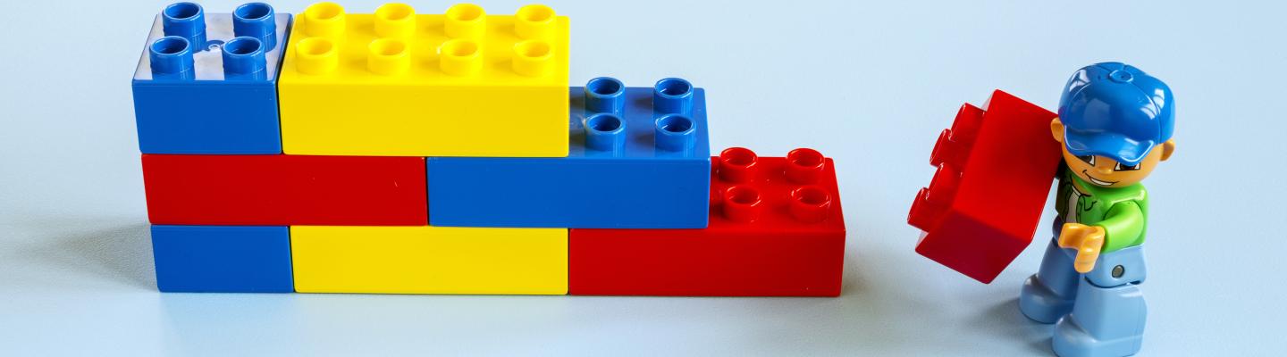 Lego figure building with lego bricks