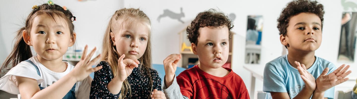 4 children using sign language