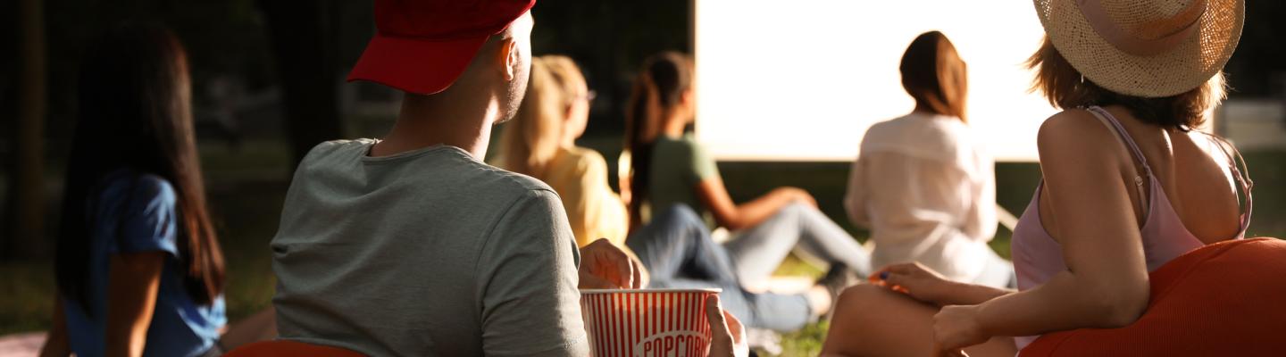 People watching a movie at an outdoor cinema