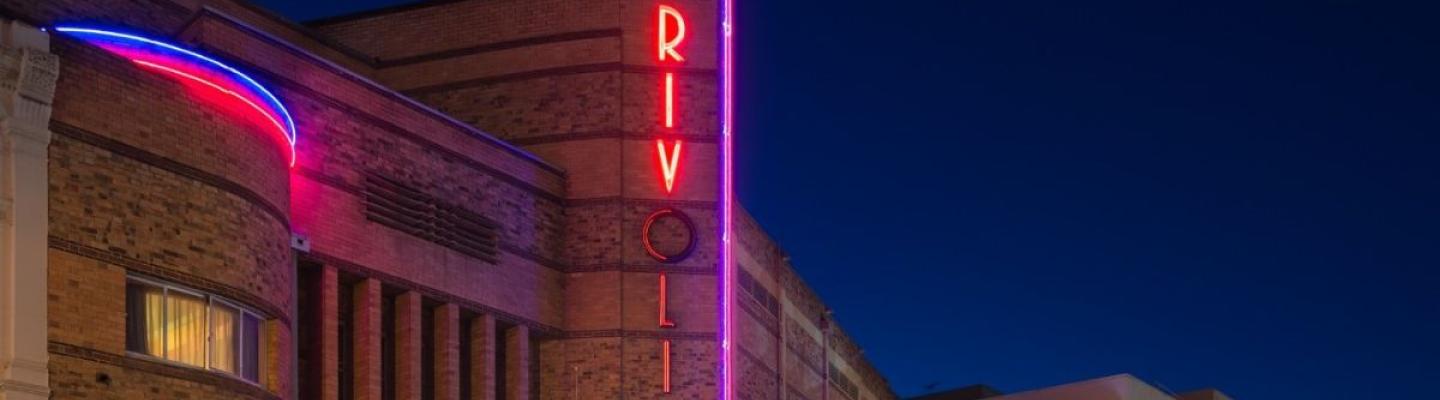 Exterior of Rivoli Cinema at night.