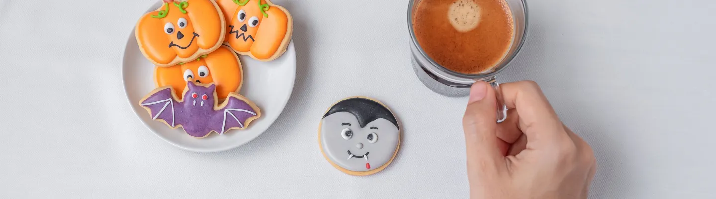 A cofee and halloween biscuits