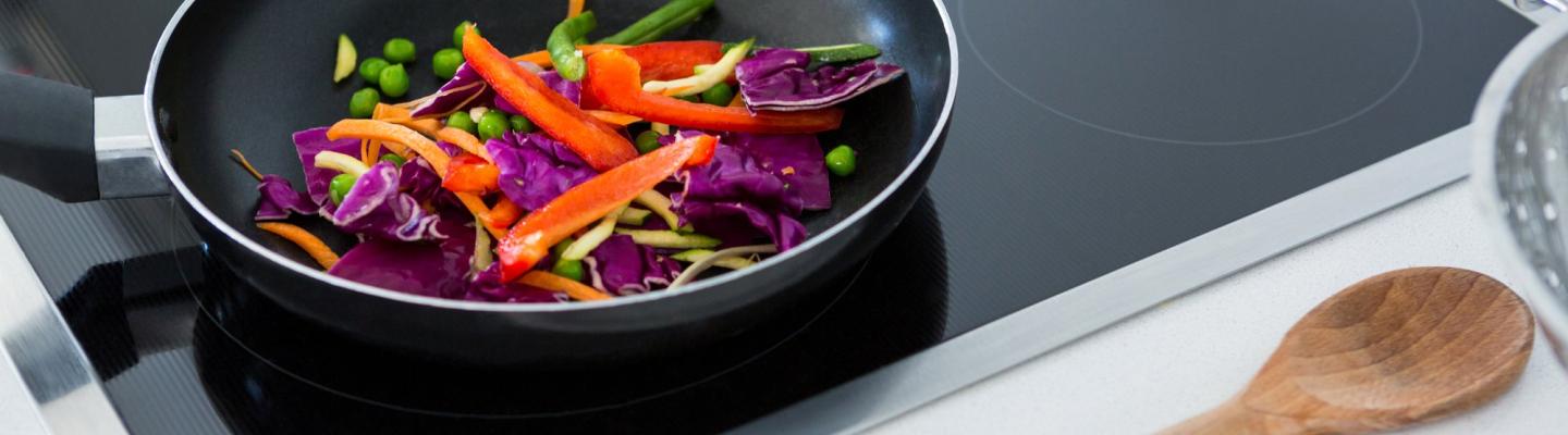 Veggies in frypan on an induction cooktop